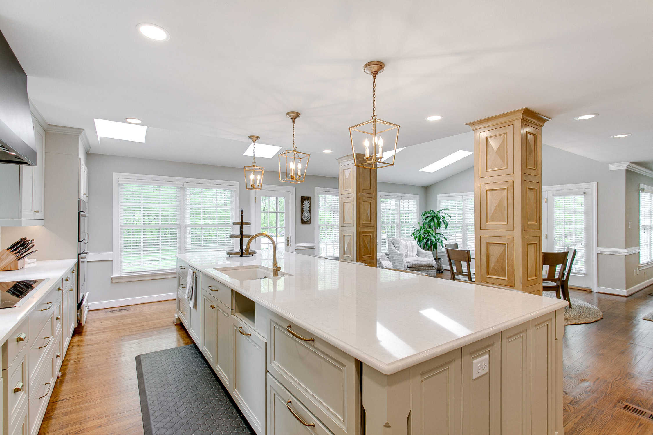 Luxury kitchen with white stone countertops,